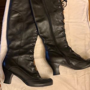 Vince Camuto black leather heeled boots with a lace up front and interior zipper